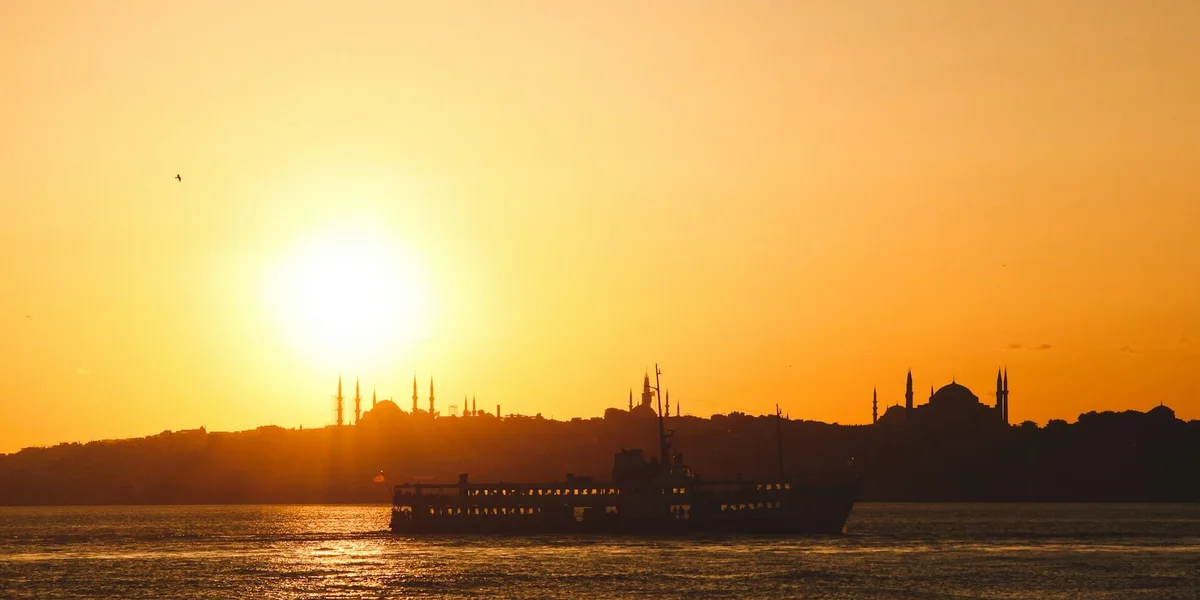 Summer sunset on the Bosphorus in Istanbul. Photo by Yusuf Onuk on Unsplash
